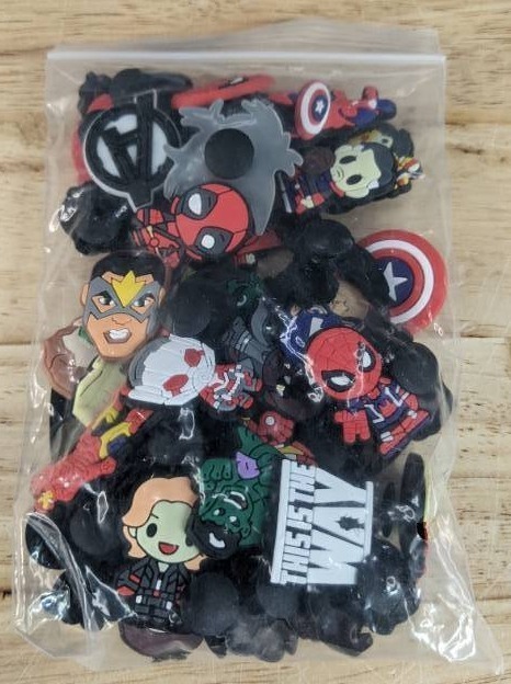 lot 43 image: Lot of 50 Brand New Croc Charms of Comic Book Characters N