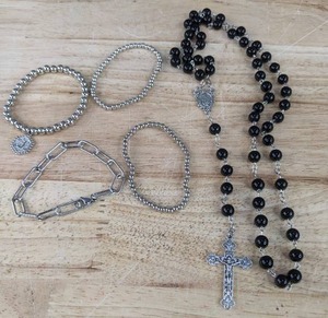 lot 75 image: Brand New Black Rosary and Four Silvery Bracelets One With Initial J N