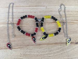 lot 74 image: Brand New Four Piece Deadpool & Wolverine Best Friend Set - Two Necklaces and Two Bracelets N
