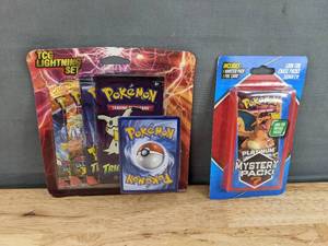 lot 39E image: Brand New Pokemon TCG Lightening Set and Mystery Pack N
