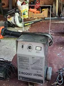lot 34 image: Schumacher Fast Charger Starter Charger 12 Volt 240200 Amp  Wheeled SE-2001