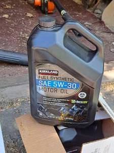 lot 61 image: Lot of (2 Bottles) Kirkland SAE 5W-30 Full Synthetic Motor Oil Quart Plastic Bottles 5-quart bottles ( 10 total quarts )