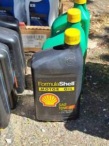 lot 65 image: Lot of (3) 10W-40 Motor Oil Quart Plastic Bottles