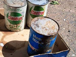 lot 81 image: (2) Castrol 2-Cycle Motor Oil Cans and (1) Target Heavy Duty Motor Oil Can (both full)