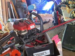 lot 131 image: Homelite Gasoline-Powered 22 Hedge Trimmer (RedBlack)