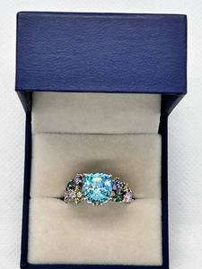 lot 8 image: Sterling Silver Rainbow Gemstone Ring with Blue Center Stone