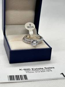 lot 16 image: Elegant Silver Ring with Heart-Shaped Center Stone, Size 8