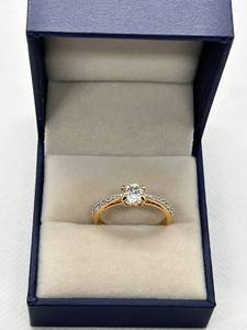 lot 22 image: Elegant Gold Engagement Ring with Sparkling Stone