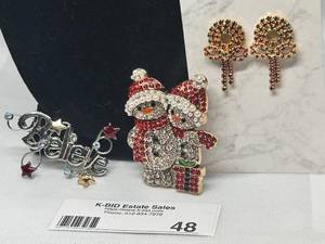 lot 48 image: Lot of 3 Holiday Brooches with Santa, Bells & Believe Designs