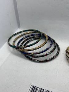 lot 125 image: Collection of 10 Assorted Bangles with Enamel and Metal Designs