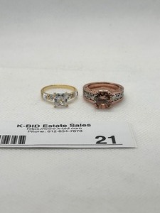lot 21 image: Pair of Elegant Rings with Crystal Settings