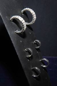 lot 150A image: Set of Three Pairs of Silver-Toned Earrings