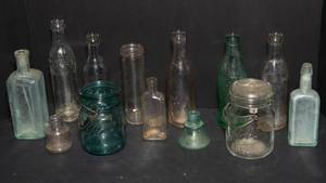 lot 184 image: Variety of Vintage Glass Bottles  Local and Iconic Brands