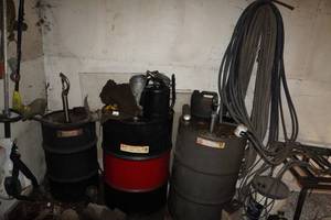 lot 465 image: Assorted Oil Barrels, Cans and Motors