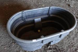 lot 470 image: Rubbermaid Large Stock Tank with Hog Waterer