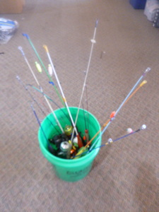 lot 90 image: Bucket of Ice Fishing Poles and Reels