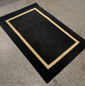 lot 85 image: Bold Black Rug by Daytons Hudson Marshall Fields