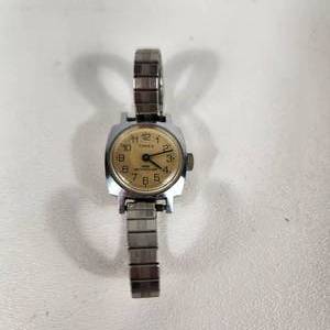 lot 15 image: Womans Timex Silver Gold Face Wrist Watch Stretchy Band Water Resistant Stainless Steel Back Great Condition Running