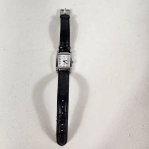 lot 22 image: Womans Iguzzini Quartz Silver Wrist Watch With Black Band Stainless Steel Back Water Resistant Great Condition Running