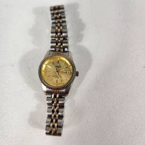 lot 23 image: Womans Vanity Fair Quartz SilverGold Wrist Watch With Date Japan Movement Stainless Steel Back Great Condition Running