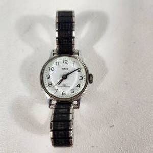lot 26 image: Womans Timex BlackSilver Wrist Watch Stretchy Band Some Scratches On Top Water Resistant Great Condition