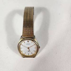 lot 31 image: Womans Jemis Quartz Gold Wrist Watch With Small Gem Stainless Steel Back Great Condition Running
