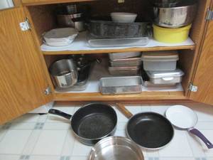lot 57 image: Cupboard of baking pans and kitchen...