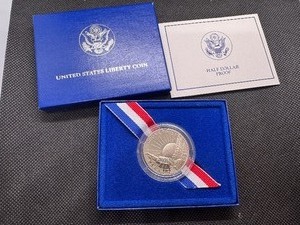 lot 90 image: 1986 S Commemorative Half BoxCOA. All in Perfect Condition