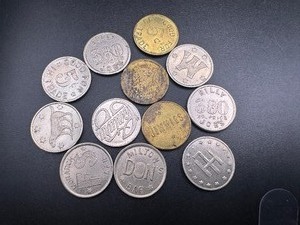 lot 67 image: (12) Vintage Shopkeeper Tokens. Variety of Defunct Establishments