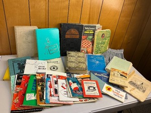 lot 21 image: Vintage & Antique Cookbook & Household Ephemera Lot Plus Apron