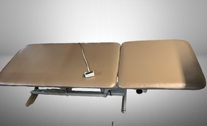 lot 2 image: Stationary Power HiLow Treatment Table -In Good Working Condition Back Rest Only Remains Flat Upholstery Excellent