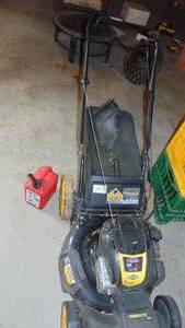 lot 109 image: Brute Lawn Mower with Small Gas Can