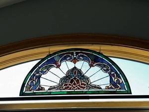 Elegant Stained Glass Window with Celtic Knot Design
