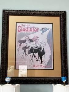 lot 53 image: Vintage Misti 95 Cycles Gladiator Framed Advertisement Poster