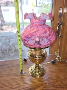 lot 514 image: Antique Hurricane Lamp with Cranberry Glass Shade