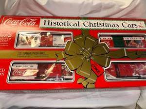 lot 2 image: Limited Edition Coca-Cola Historical Christmas Cars 4-Pack Set