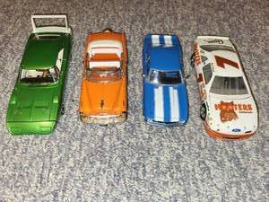 lot 62 image: Set of 4 Diecast Model Cars Including Dodge Daytona, Convertible, Camaro, and Hooters Race Car