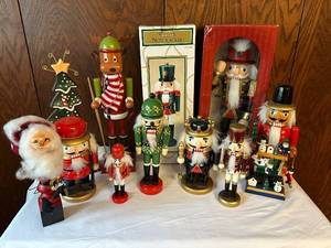 lot 169 image: Collection of 10 Nutcracker Figurines Including Soldiers, Santa, and Reindeer