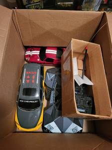 lot 263 image: Collection of 4 Remote Control Cars with 2 Controllers