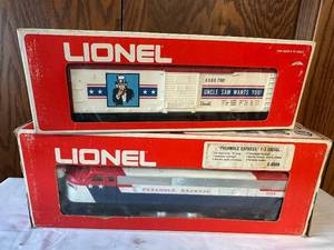 lot 296 image: Lionel Preamble Express F3 Diesel & Uncle Sam Box Car Set