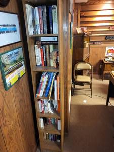 lot 443 image: Collection of Historical and Train-Themed Books on Wooden Bookshelf