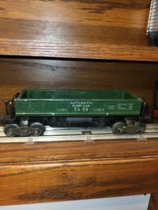 lot 459 image: Set of Vintage Lionel Train Cars Including Auto-Loader, Tanker, and Dump Car