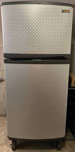 lot 75N image: G - Gladiator 19 cu ft Top Freezer Refrigerator with Diamond Plate Finish and Casters