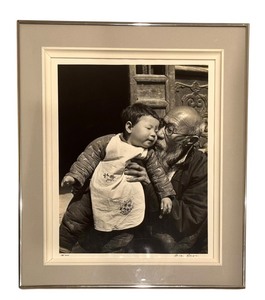 lot 37HA image: Dmitri Kessel Old Hsu, Venerated Lark Trainer and Elder of Red Pepper Village in Northeastern China with His Granddaughter