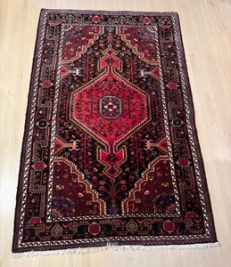 lot 28 image: K - Persian Style Area Rug 69 x 44 Inches with Geometric Medallion Pattern