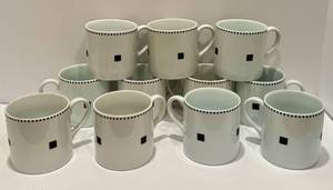lot 93 image: K - Set of 11 Vintage Swid Powell Porcelain Tuxedo Coffee Cups