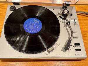 lot 217 image: LLO - Sanyo TP 1010 Turntable with Dust Cover and Vinyl Record