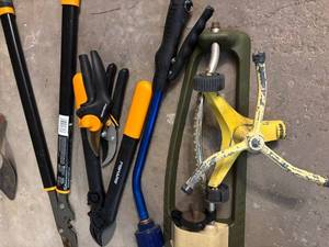 lot 241 image: G - Mixed Lot of Garden Tools Including Pruners, Loppers, Sprinkler, and Saw