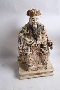 lot 12 image: Intricately Detailed Porcelain Sculpture of Asian Deity