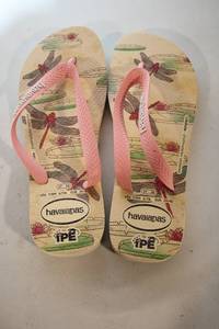 lot 92 image: Havaianas IPE Edition Flip Flops with Dragonfly Design